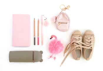 Flat lay. Notepad, pencils, pen, pencil case, keychain and kids snickers.
