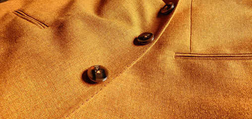 Brown-Orange woolen coat close up.