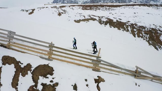 3 man skitouring at the Shymbulak mountain resort, Almaty, Kazakhstan. Aerial.