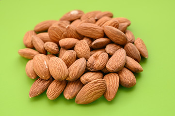 Pile of almon on green background.