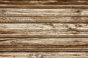 Dry peeling paint wooden plank. Grunge brown desks. Natural weathered wood texture background.
