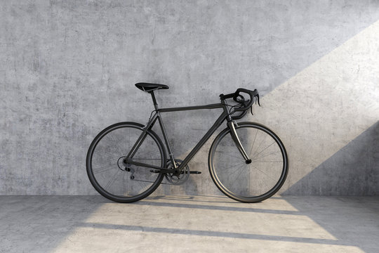 black sport bike on concrete wall background
