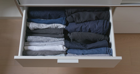 Open the drawer with clothes