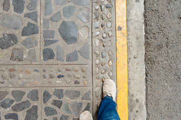 walking by stone pavement