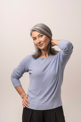 Obraz premium Beautiful Mongolian Woman with Gray Hair on a White Background.