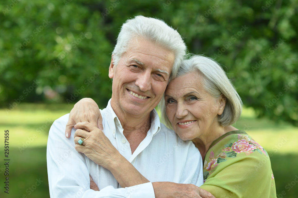 Wall mural portrait of mature couple in summer park