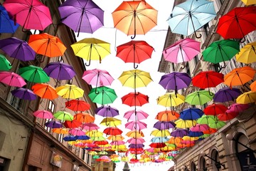 Fototapeta na wymiar Colorful umbrellas in shopping street