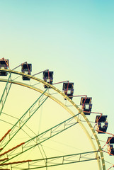 Fragment of ferris wheel in the evening lighting
