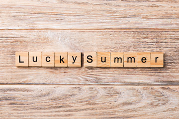 Lucky Summer word written on wood block. Lucky Summer text on wooden table for your desing, concept