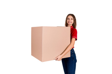 Friendly young delivey girl brings a big parcel for a customer isolated on white background