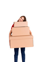 Portrait of a happy smiling delivery woman with heap of big boxes isolated on white background