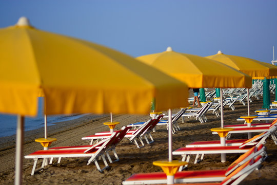yellow beach umbrellas near the sea
