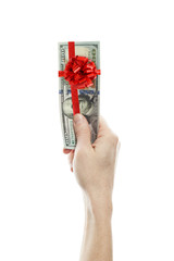 US dollars gift profit. Money cash with red ribbon and bow in man hand isolated on white background. American Dollars 100 banknote gift