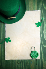 St. Patrick's Day. Leprechaun hat with empty blank and wax seal with shamrock