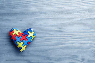 World Autism Awareness day, mental health care concept with puzzle or jigsaw pattern on heart