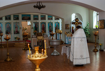 RUSSIA. KEMEROVO - JULY. 22 2007. priest of the Orthodox Church in festive liturgical attire conducts service in the Church. white felon