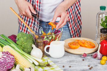 Woman cooks at the kitchen, body part, blurred background
