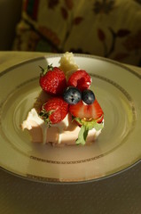a slice of cake with fresh berries