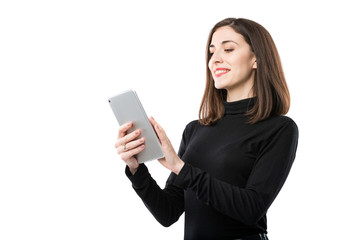 Naklejka premium Woman business technology theme. Beautiful young caucasian woman in black shirt posing standing with tablet hands on white isolate background. Profession Marketer Sales Social Media Advertising