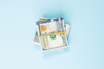 American Dollars 100 bill banknote on blue background
