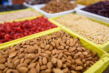 Background of raw almonds in yellow box