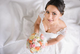 beautiful bride at home is smiling