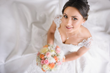 beautiful bride at home is smiling