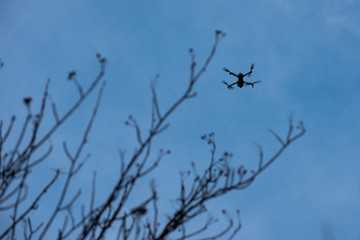 drone flying in blue sky