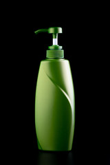 plastic container with pump on black background.