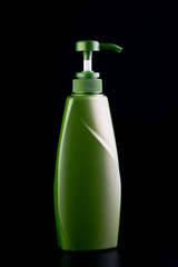 plastic container with pump on black background.