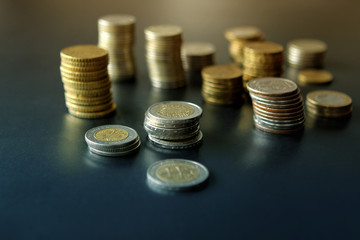 Closeup of silver and copper coins of all states on a dark background
