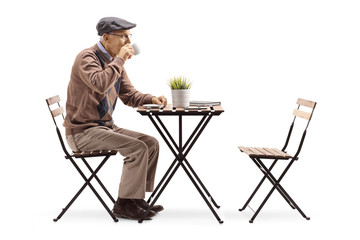 Senior man sitting alone and drinking coffee
