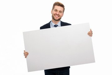 Business man holding white board