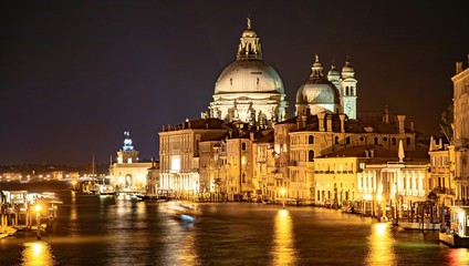 Fototapeta na wymiar Italy beauty, night Grand canal and cathedral Santa Maria della Salute taken from Academia bridge in Venice, Venezia