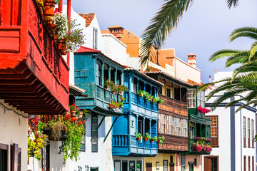 Traditional colonial architecture of Canary islands . capital of La palma - Santa Cruz with colorful balconies - obrazy, fototapety, plakaty