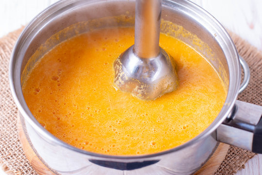 Pumpkin or carrot pureed for soup with blender