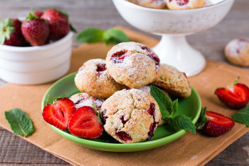 Homemade cookies with strawberries and icing sugar