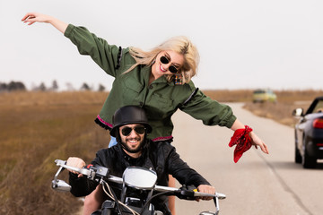 Beautiful young couple traveling Motorbike