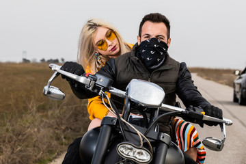 Beautiful young couple traveling Motorbike