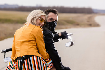 Obraz premium Beautiful young couple traveling Motorbike