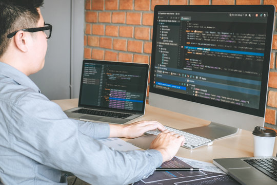 Professional Developer programmer working a software website design and coding technology, writing codes and database in company office, Global cyber connection technology