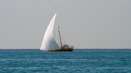 Sailing yacht with white sails