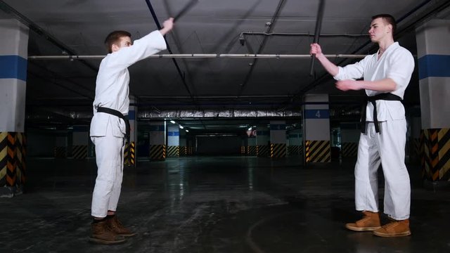 Two men greeting each other before the training sword fight