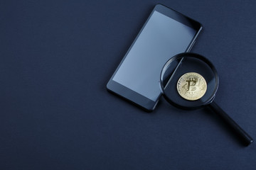 Fototapeta na wymiar coin bitcoin under a magnifying glass