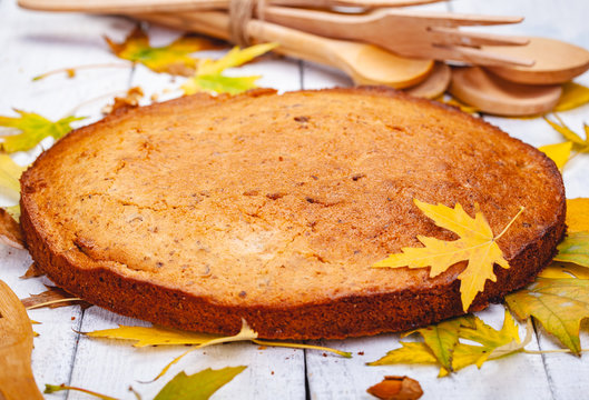 Semolina cake or manna pie with walnuts and raisins on wooden rustic table. Close up