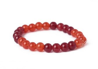 Stone bracelet red with white background. 