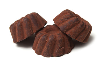 Closeup of chocolate truffles in shaped Kougelhopf on white background