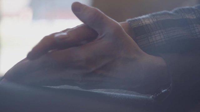 Old hands of man and woman holding and stroking fingers