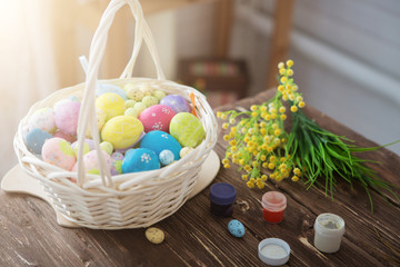 Painting eggs for easter holiday celebration. Colorful easter eggs and brushes on wooden table
