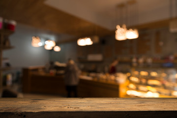 blurred background of bar and dark brown desk space of retro wood